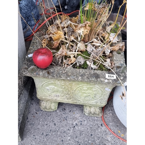 884 - Star lot : A large antique  stone outdoor planter with paw feet.