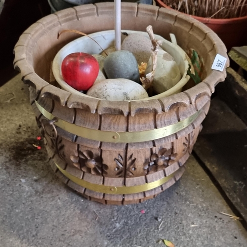 887 - Two planters including a carved wooden example with brass banding and a ceramic example.