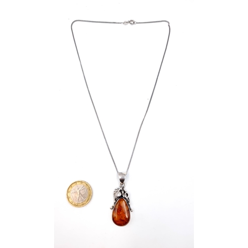 900 - A fine example of a Baltic Amber sterling silver leaf mount pendant necklace, with a chain length of... 