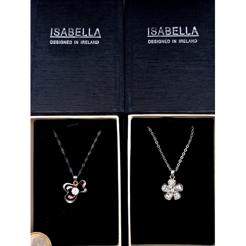 922 - Two boxed as new Irish Design items, including two floral designed gem set pendant necklaces.