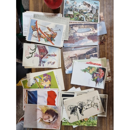 943 - A large collection of colourful vintage postcards from countries such as France, Australia and Swede... 