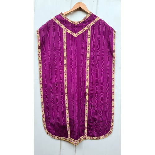 970 - An ornate vintage purple and gilt taffeta chasuble vestment worn by the presiding priest during mass... 