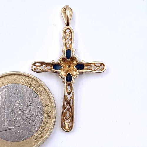 17 - A lovely 9ct gold (no marks) cross pendant, featuring pretty Sapphire and gem stone settings. Dimens... 