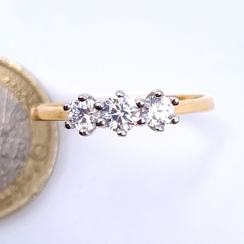 24 - A very pretty 9 carat gold gem set three stone ring. Ring size: T 1/2. Weight: 2.28 grams.