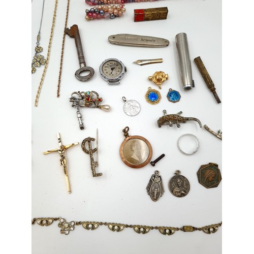 32 - A large collection of assorted vintage jewellery unchecked items, including watches, brooches, penda... 