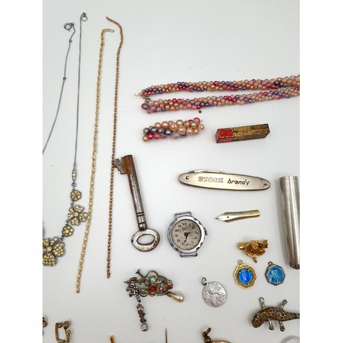 32 - A large collection of assorted vintage jewellery unchecked items, including watches, brooches, penda... 