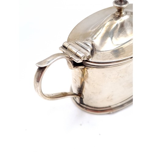 37 - A very fine example of a Georgian sterling silver mustard pot, featuring a hinged lid, finial top, f... 