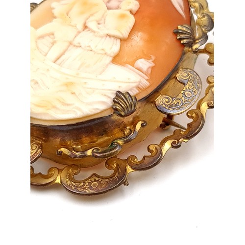 43 - A magnificent example of a Victorian Italian shell pinch back large Cameo brooch, featuring a quaint... 