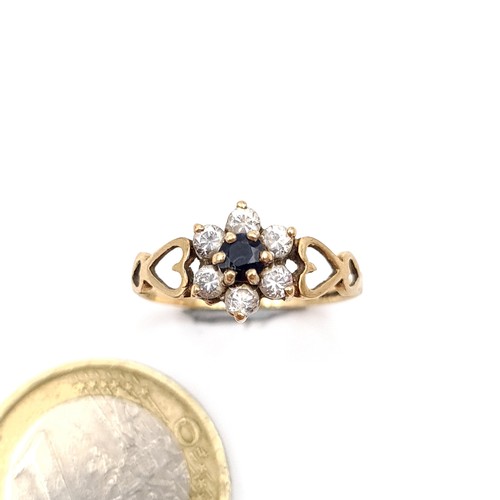 51 - An unusual vintage 9 carat gold gem set Daisy cluster ring, featuring a pretty heart shaped dual set... 