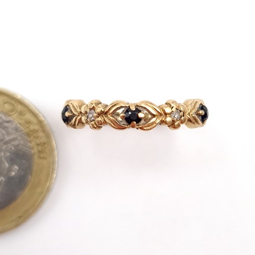 54 - A pretty antique Diamond and Black Spinel 9 carat gold ring. Ring size: L. Weight: 1.49 grams.