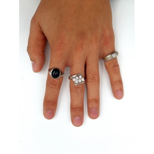 901 - A collection of three sterling silver rings, each featuring sparkling gem stone settings. Ring sizes... 