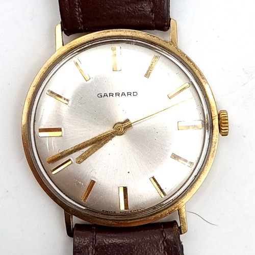 919 - Star Lot : A super 9ct Gold Garrard gentleman's vintage wrist watch, set with baton dial and sweep s... 