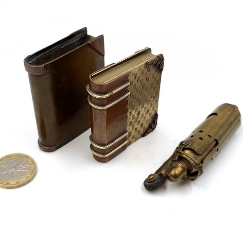 958 - Three vintage lighters, including a brass example in the form of a whistle, along with two brass and... 