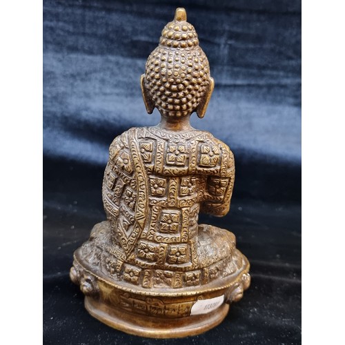 133 - Star Lot: A heavy bronze figure of a seated Indian deity. Features great detail throughout. H20cm.