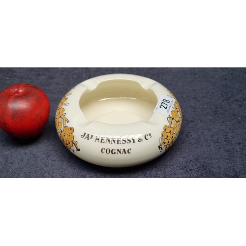 278 - A beautiful rare vintage ceramic ashtray by James Hennessy & Co Cognac, featuring vine and grape mot... 