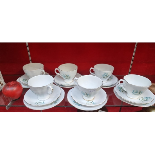 An 18 piece vintage tea serving fine bone China set,  by Regina Consort. This fine set is in very good condition and each features gilded rims and a beautiful turquoise Lilly of the Valley motif.