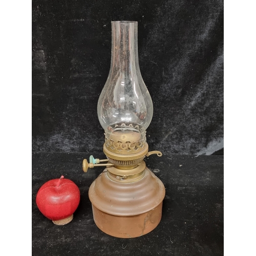 278 - A John Levick Birmingham copper and brass oil lamp with hurricane glass.