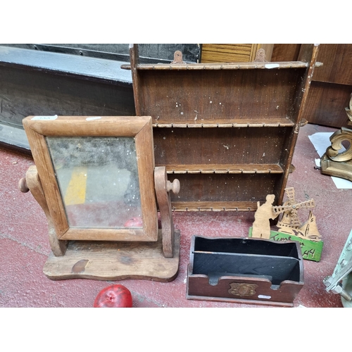 355 - Four items including a Mid Century vanity mirror, a letter box, a wind mill wall plaque and display ... 