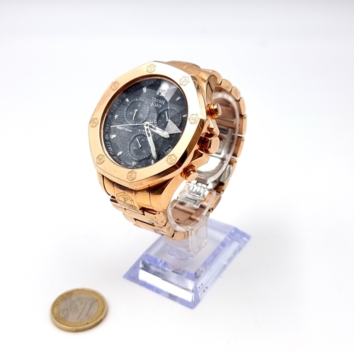 463 - A very heavy example of a Tresor 18 carat chronograph rose gold plated wrist watch, with stylish bla... 