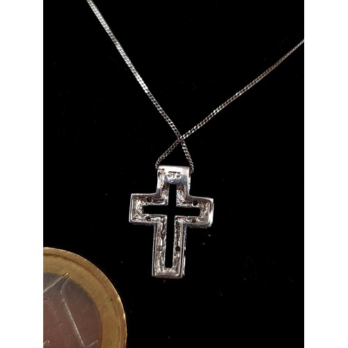 477 - Star Lot: A show stopping 9 carat White Gold Diamond cross pendant necklace, with a length of 40cm. ... 