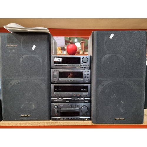 598 - A high quality Technics home stereo system along with two excellent speakers. Stereo integrated ampl... 