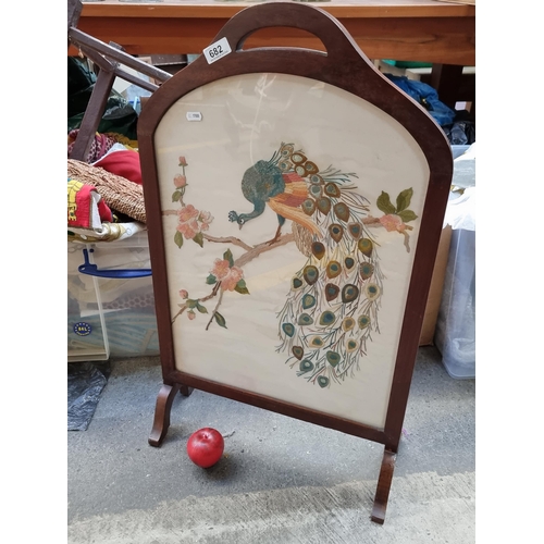 682 - A lovely Midcentury fire screen with silk embroidered panel to front displaying a peacock perched on... 