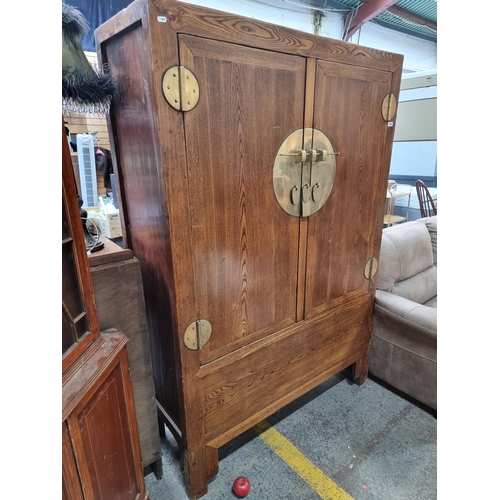 718 - Star Lot : A fabulous Chinese wedding cabinet. Features large brass fitting to front with traditiona... 