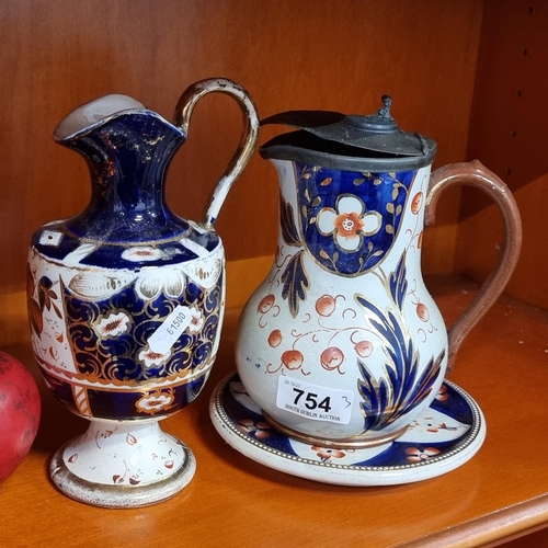 754 - Three Victorian ceramic pieces including a porcelain Imari style jug vase and a stoneware Imari styl... 