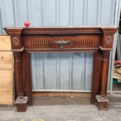 762 - A wonderful solid mahogany fire place featuring beautiful carved detail and boasting columns to both... 