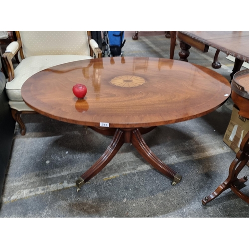 771 - Star Lot : An elegant Edwardian style table with an oval top which rotates and rises for dining  and... 