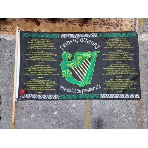 951 - A large flag with printed lyrics of 'The Fields of Athenry' and Irish harp.