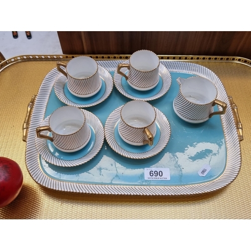 690 - A very sweet retro tea set made by Burslem including four cups and saucers, milk jug and tea tray. T... 