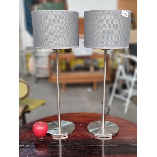 1090 - A pair of stylish contemporary chrome table lamps