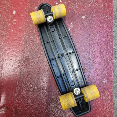 147 - A retro FAS Italy LEM skateboard in a black textured finish with yellow wheels. in nice clean condit... 