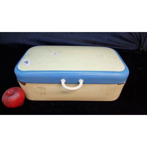 204 - A very cool 1950's enameled bread bin / picnic box filled with bakelite plugs and light fittings.