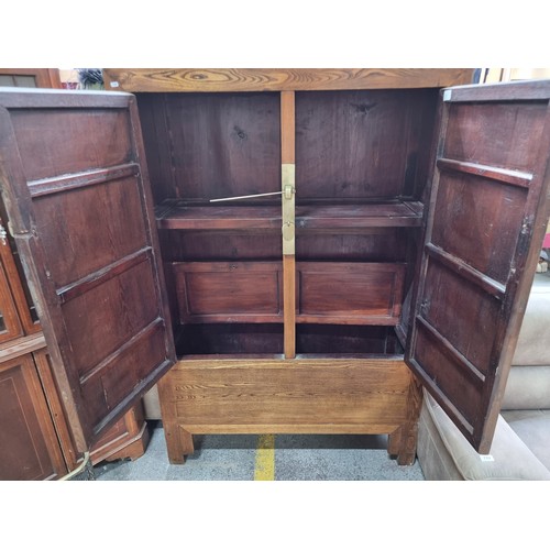 718 - Star Lot : A fabulous Chinese wedding cabinet. Features large brass fitting to front with traditiona... 