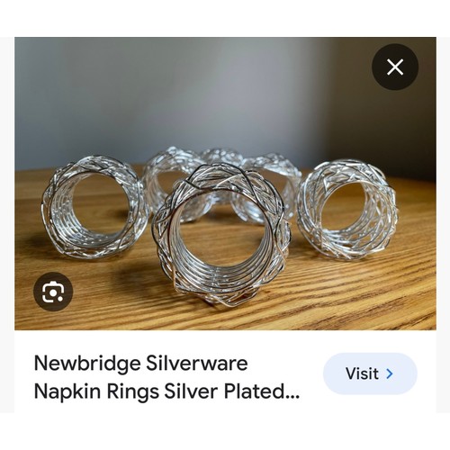 200 - A collection of eight gold toned napkin rings along with six silver toned new bridge Silver napkin r... 