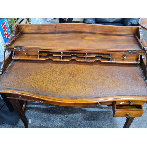 769 - A very elegant late 20th century bow front bureau with the top opening to reveal desk pull-out desk ... 