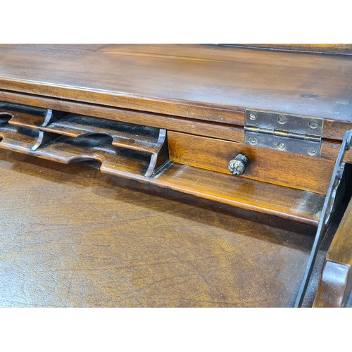 769 - A very elegant late 20th century bow front bureau with the top opening to reveal desk pull-out desk ... 