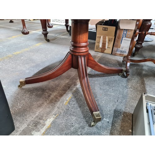 771 - Star Lot : An elegant Edwardian style table with an oval top which rotates and rises for dining  and... 