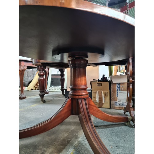 771 - Star Lot : An elegant Edwardian style table with an oval top which rotates and rises for dining  and... 