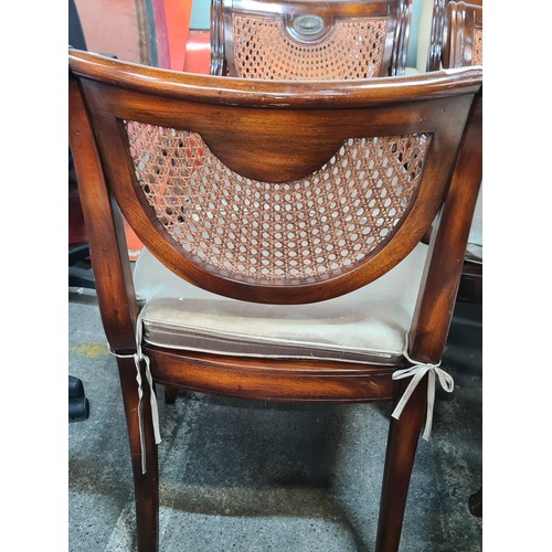 775 - Star Lot : A set of six Edwardian style walnut dining chairs with unusual demilune wicker backrests ... 