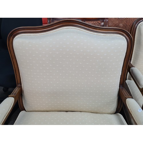 776 - Star Lot : A pair of elegant oversized  French style armchairs from Grange. With wide backrests and ... 