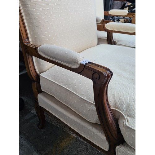 776 - Star Lot : A pair of elegant oversized  French style armchairs from Grange. With wide backrests and ... 