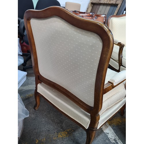 776 - Star Lot : A pair of elegant oversized  French style armchairs from Grange. With wide backrests and ... 