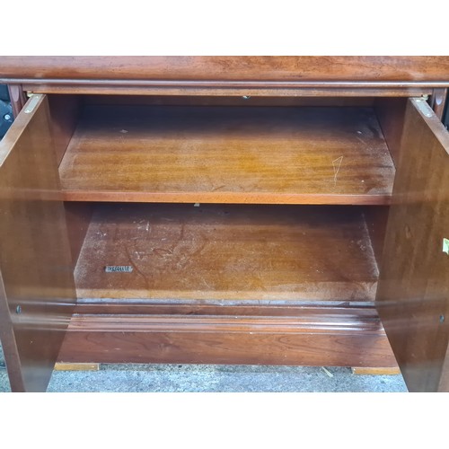 767 - A pair of very handsome Mid Century bedside cabinets with a shelf each and a hidden drawer for valua... 