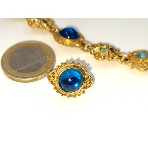 413 - A stunning vintage  gold toned multi stone necklace, with a weight of 44 grams. Accompanied by a pai... 