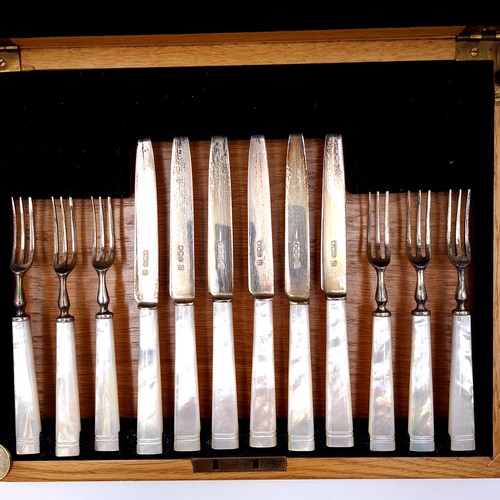 427 - Star Lot : An excellent example of a vintage wooden cased sterling silver canteen, All blades fully ... 