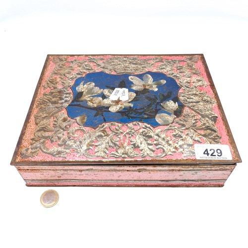 429 - A fabulous vintage pink toned metal floral tin, featuring a gilded interior and a large selection of... 