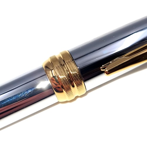 438 - A fine example of an as new brushed chrome Executive Cross ball point pen, encased in original gift ... 